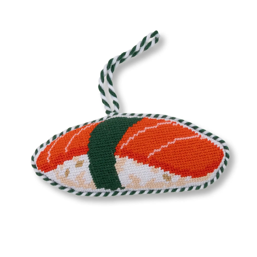 Salmon sushi needlepoint ornament, side view of nigiri with nori band and green and white cord