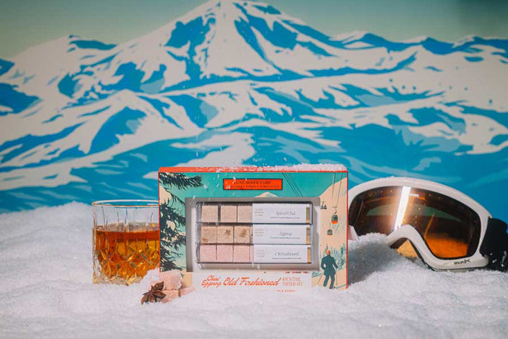 Old fashioned mixer cubes and bourbon for a festive cocktail