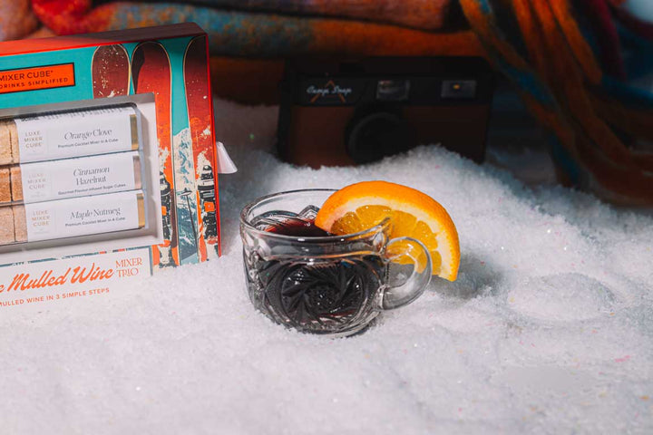 Warm spiced mulled wine made with a mixer cube by the fire