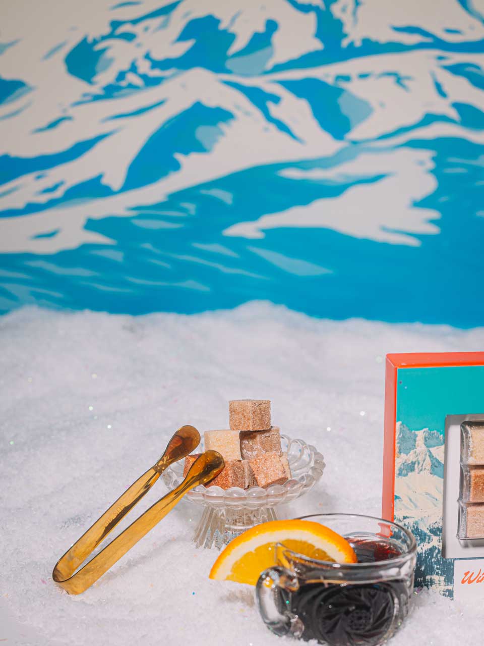 Cozy mulled wine styled for a chalet night with mixer cubes