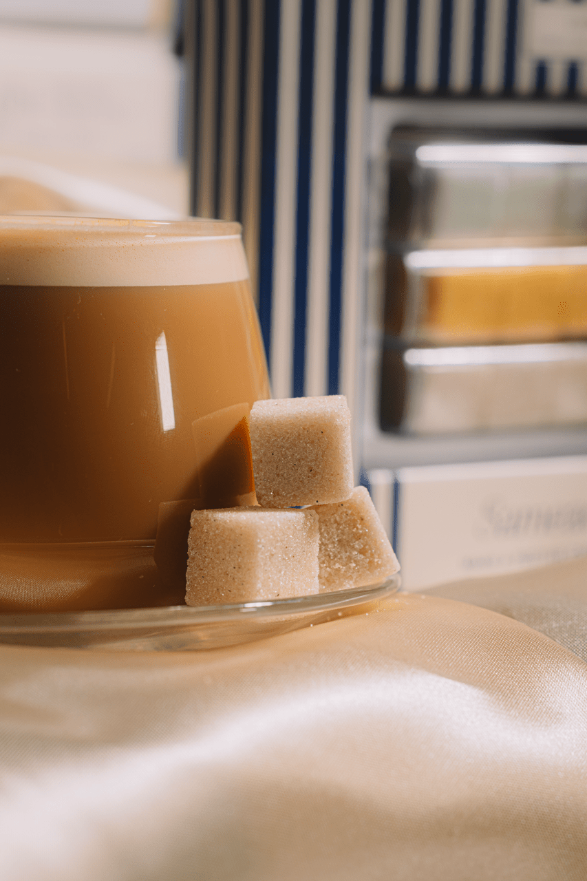 Festive latte styled for a holiday morning with mixer cubes