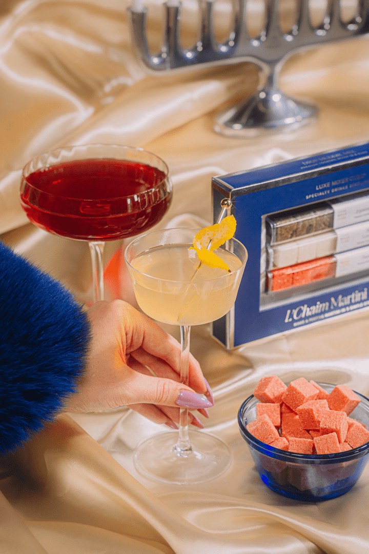 Shimmering pomegranate martini made with a mixer cube for Hanukkah