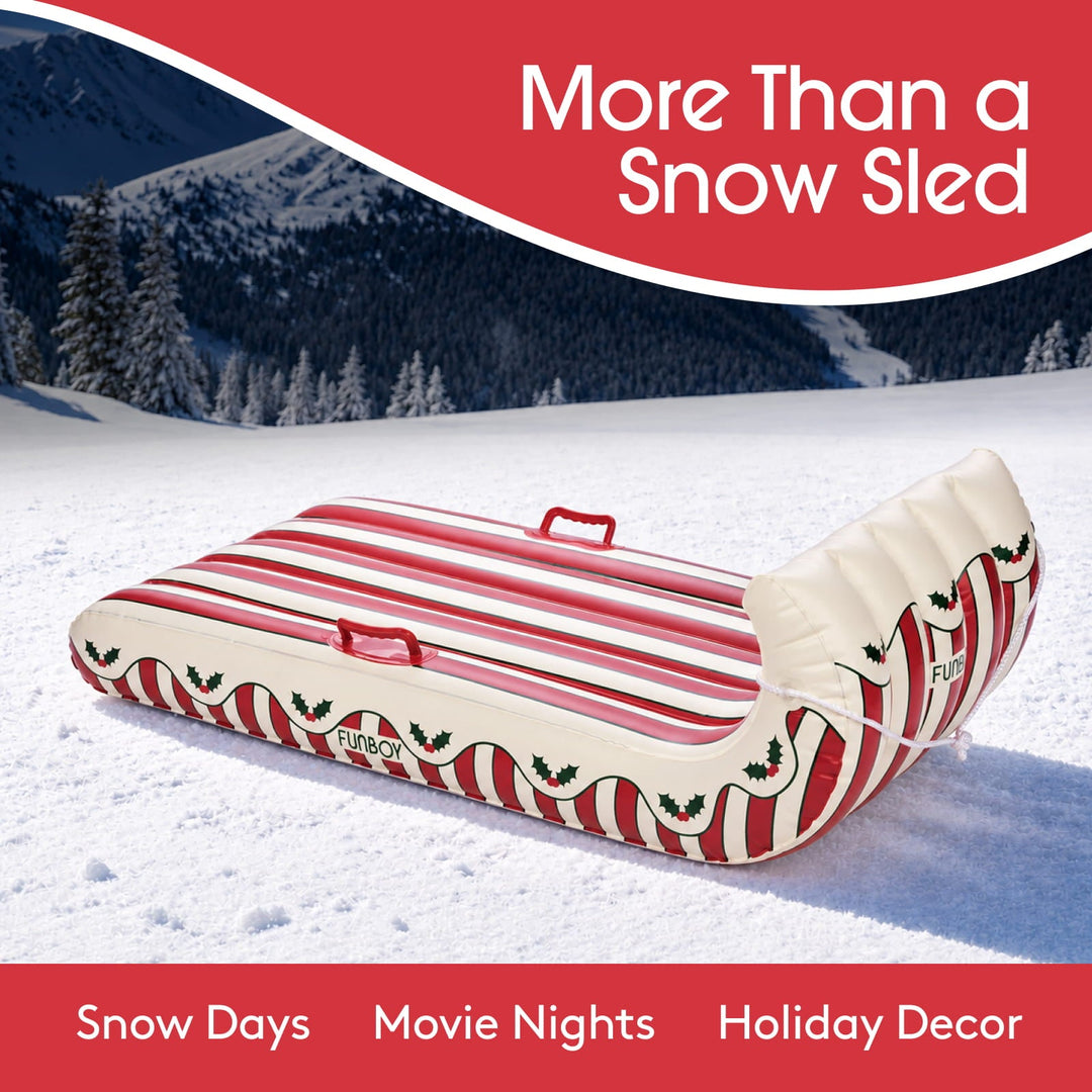 Holly inflatable sled on snow labeled for snow days, movie nights, and holiday decor