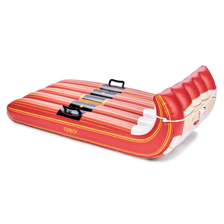 Inflatable Santa toboggan sled with red and white stripes and a Santa face at the curled front