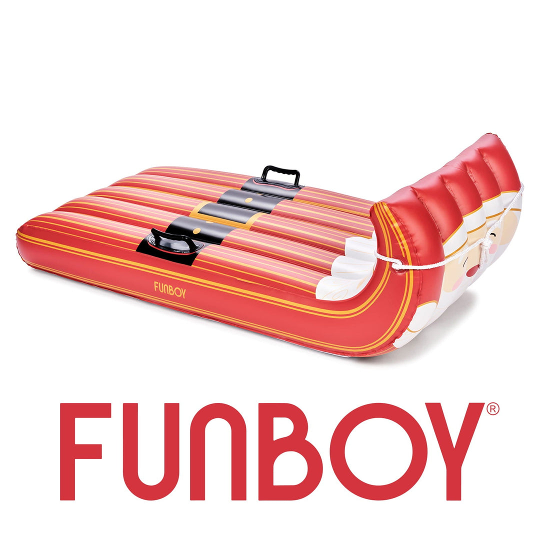 Side view of the red and white Santa inflatable toboggan sled on white