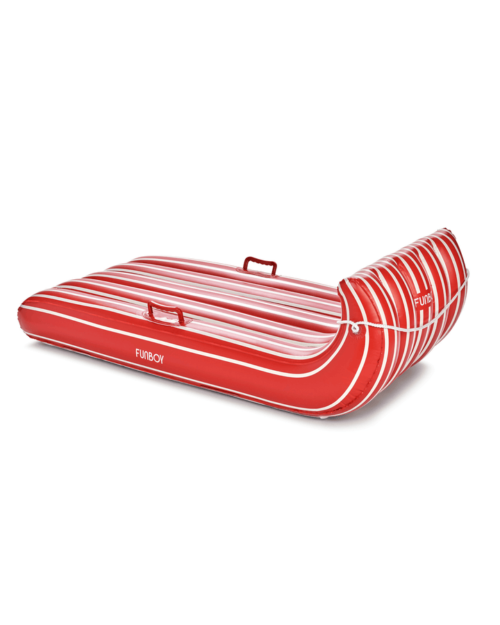 Red and white striped inflatable toboggan sled on white