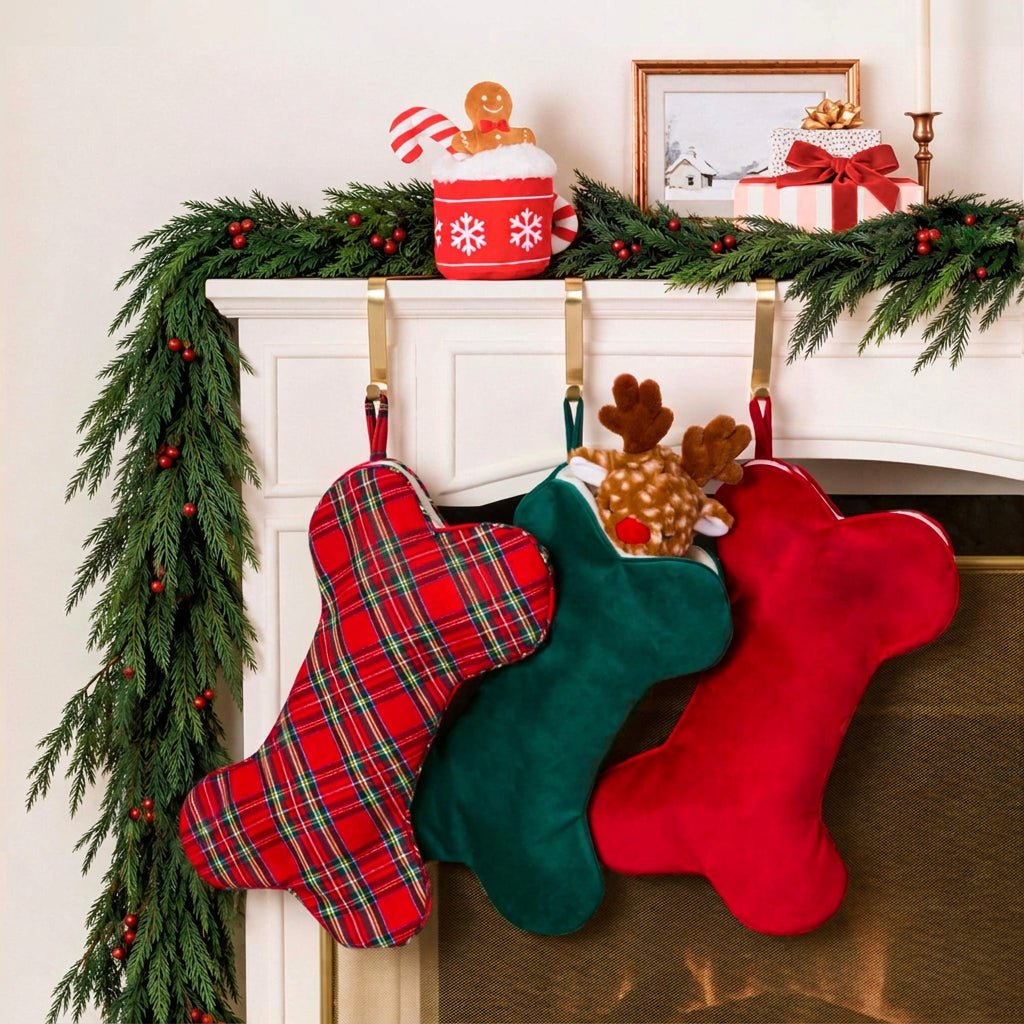 Garland mantel hung with tartan, green velvet, and cranberry velvet dog stockings