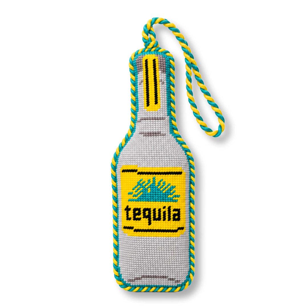 Tequila bottle needlepoint ornament, front view with yellow label, teal agave, and twisted teal and yellow cord loop
