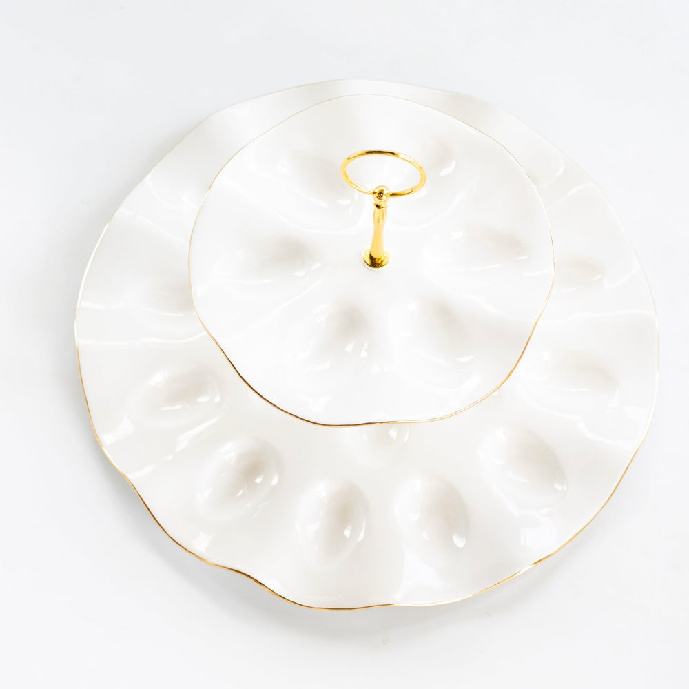 Top view of the tiered egg platter showing both rings of egg wells and the gold edges