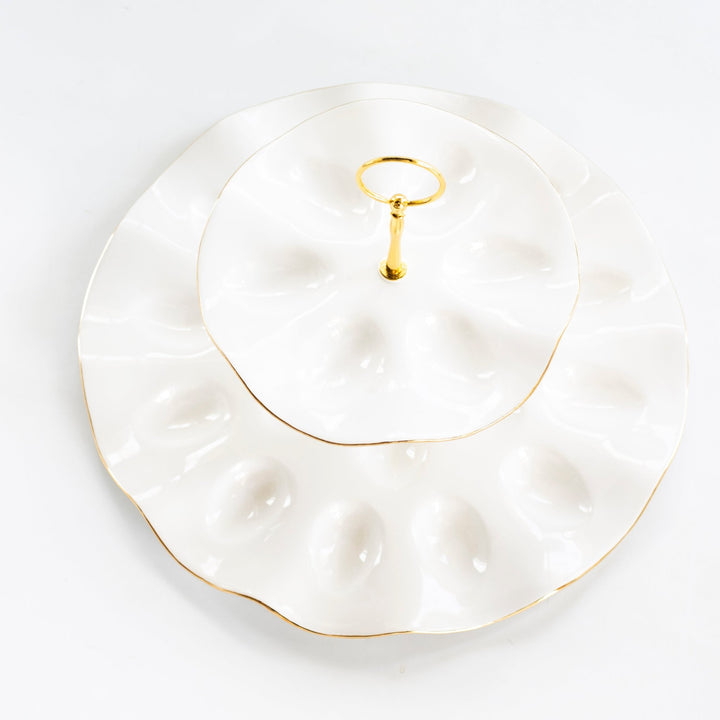 Top view of the tiered egg platter showing both rings of egg wells and the gold edges