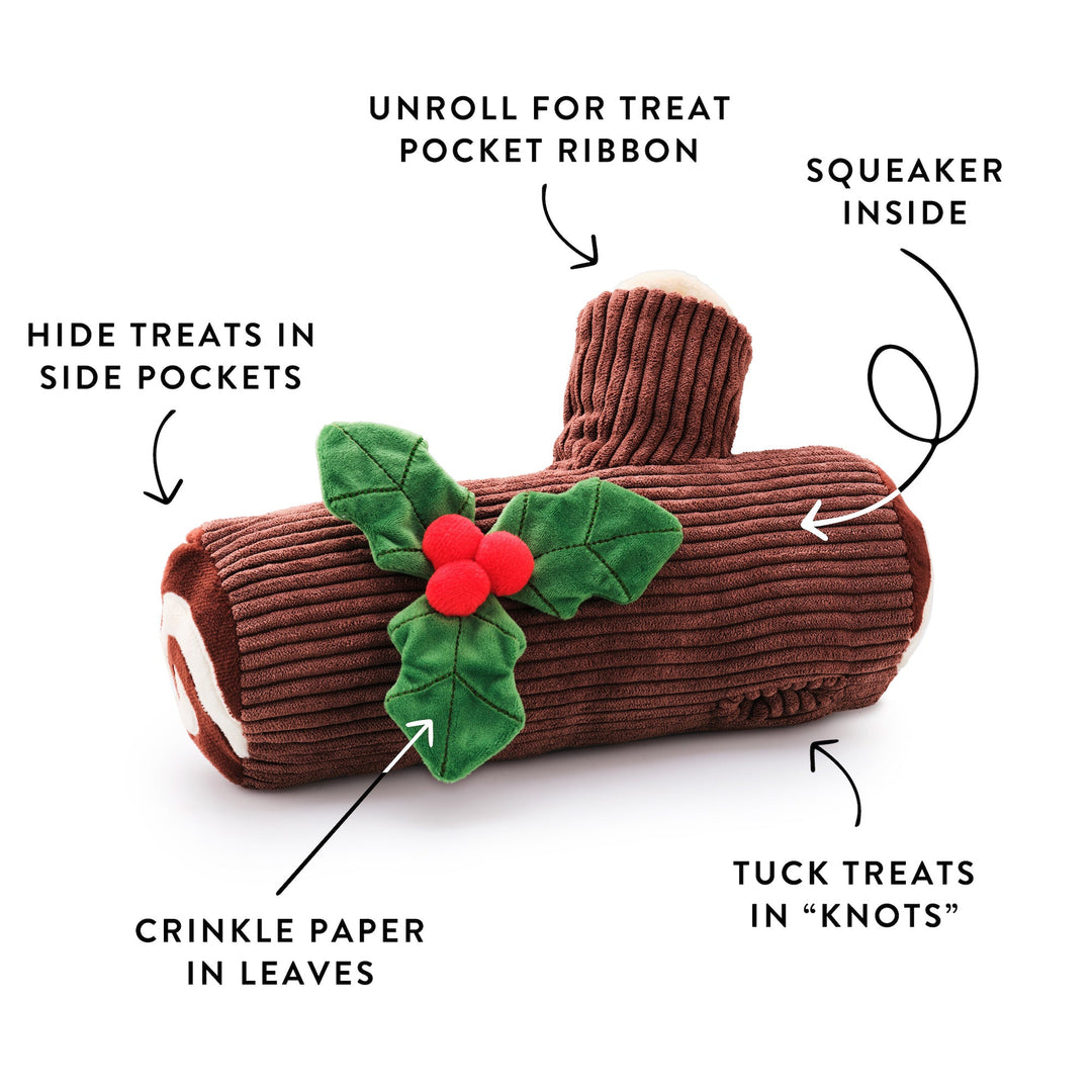Yule log toy labeled with treat ribbon, side pockets, bark knots, squeaker, and crinkle leaves