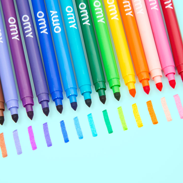 Fanned set of ultra-washable markers in rainbow colors on a pink background