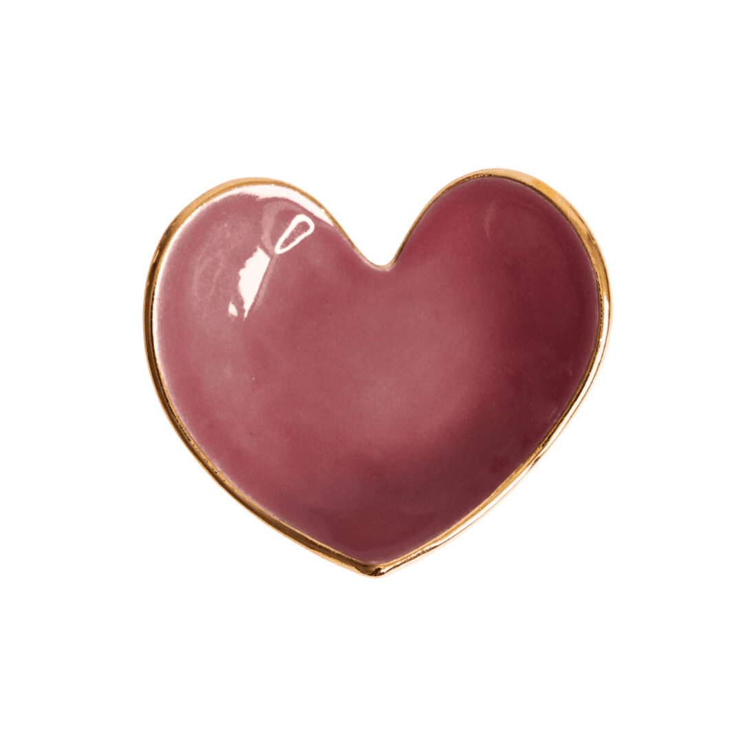 Glossy mauve plum heart ring dish with a gold rim on white
