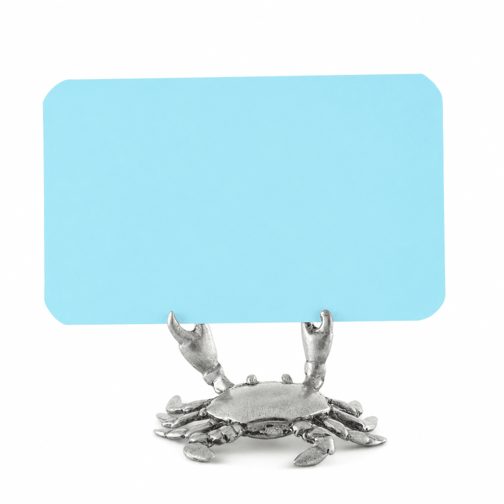 Pewter crab place card holder gripping a blank blue card in its raised pincers