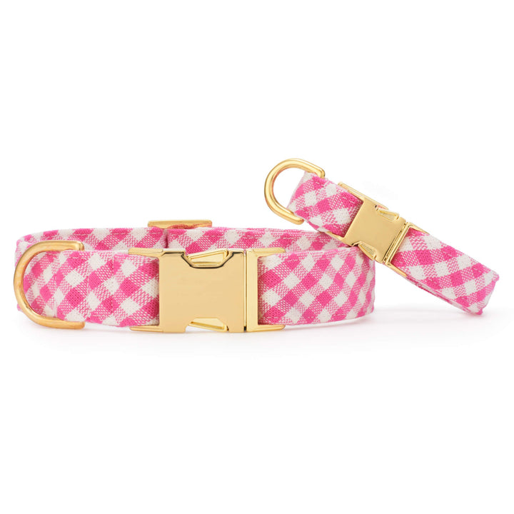 Two hot pink gingham dog collars in different widths