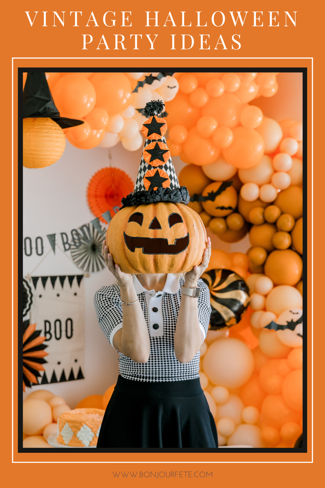 A person wearing a black and white gingham shirt and a black skirt holds a carved jack-o'-lantern pumpkin to their face, with a festive orange and white Halloween party setup in the background featuring balloon garlands, paper fans, and a witch hat. Text at the top reads 'VINTAGE HALLOWEEN PARTY IDEAS'.
