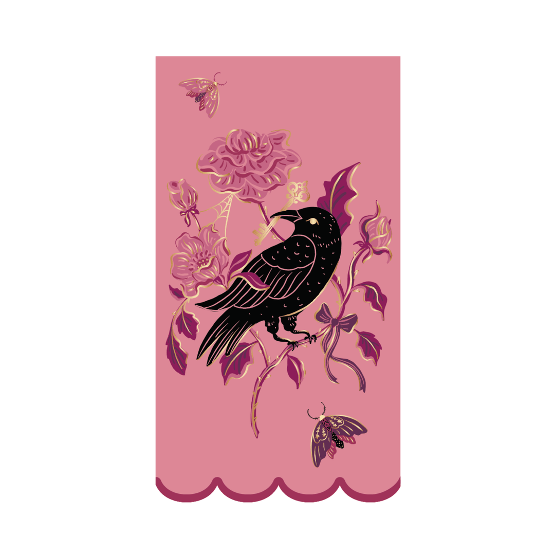 Pink Halloween guest towel with a black raven, mauve roses, gold accents, and a scalloped edge