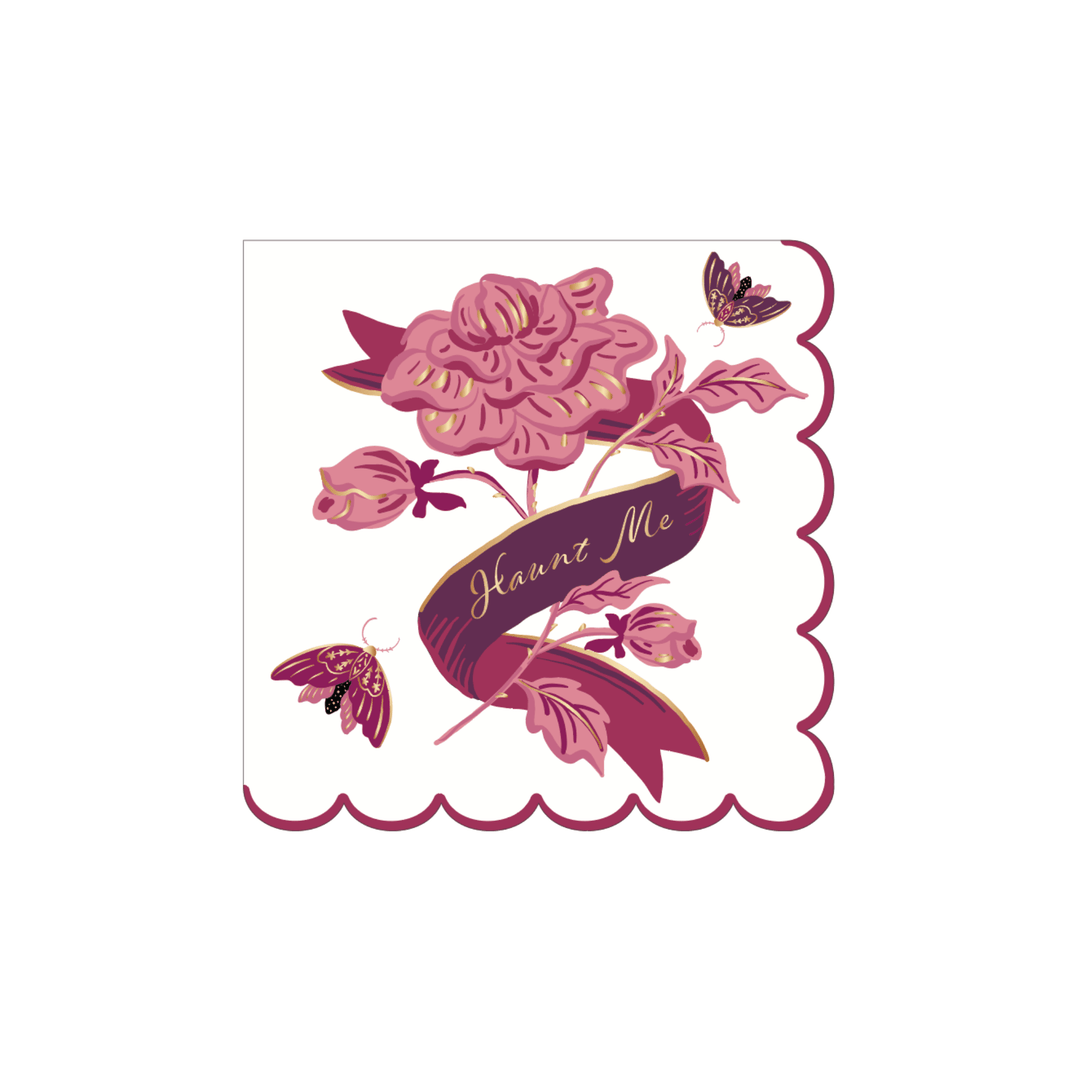 Cream Halloween cocktail napkin with a pink rose, moths, and gold Haunt Me script on a scalloped edge