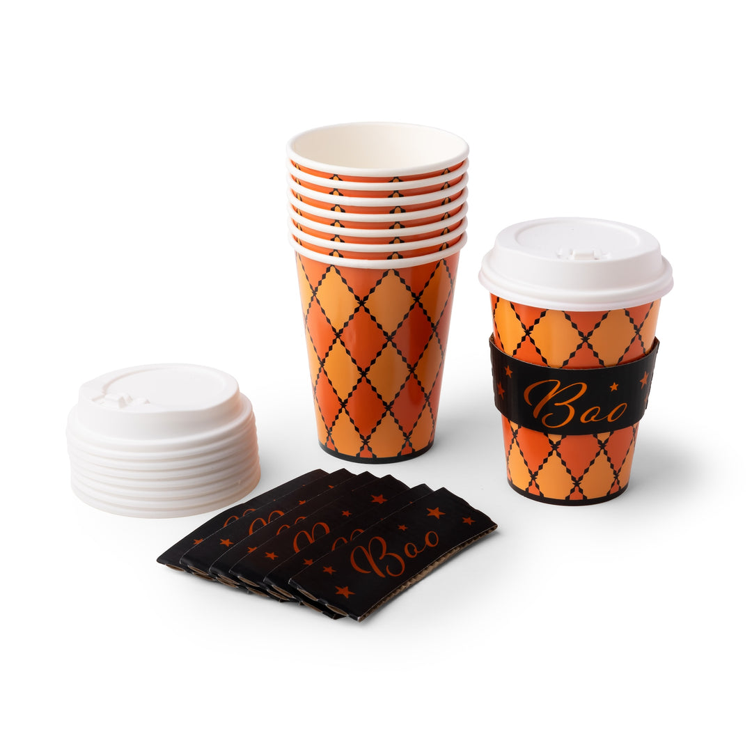 A set of Halloween-themed paper cups and lids on a white background. The cups feature an orange and yellow argyle pattern with black dotted lines, and are accompanied by black paper sleeves printed with 'Boo' in gold script and a stack of white plastic lids.
