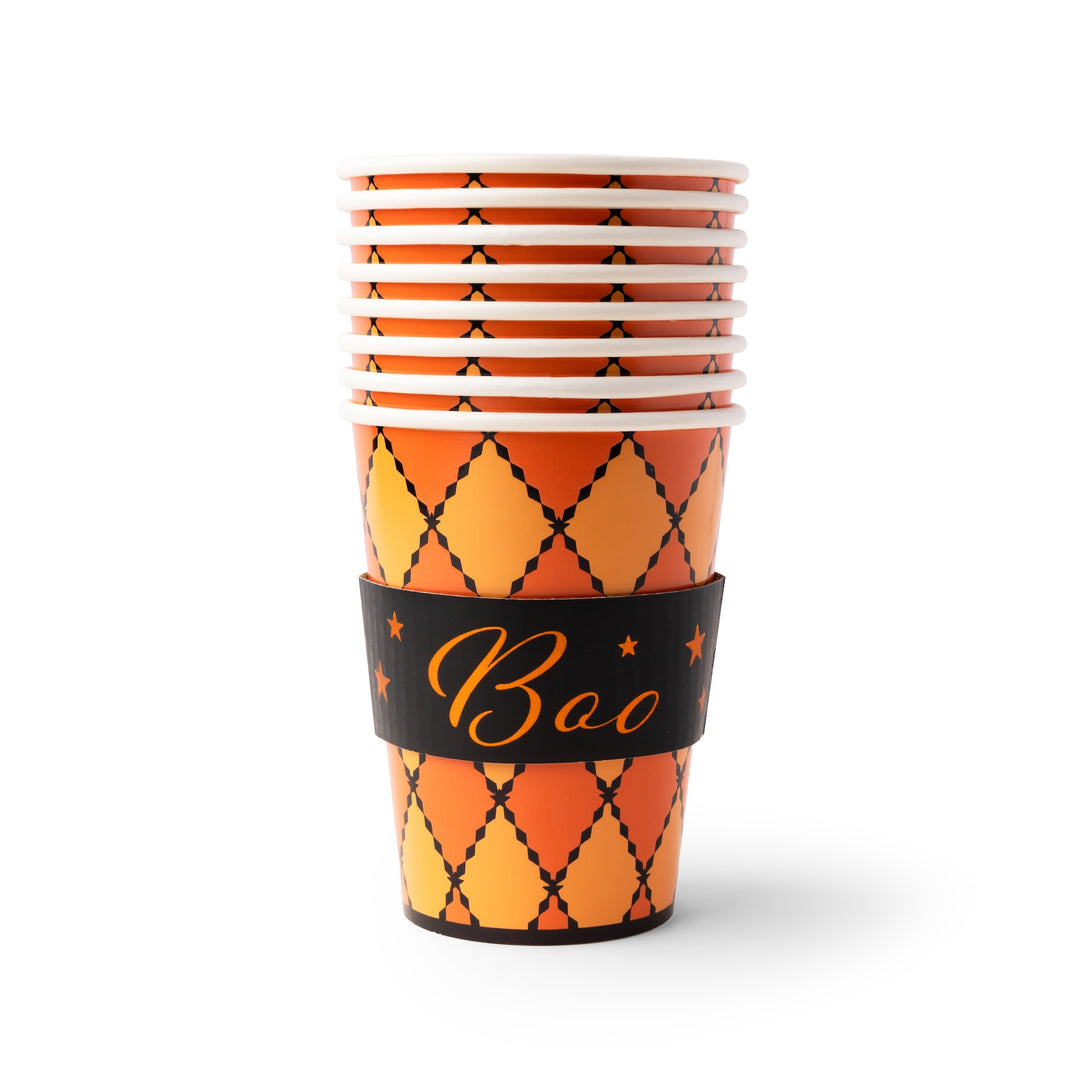 A stack of Halloween party cups with an orange and yellow argyle pattern, featuring a black paper sleeve around the middle with the word 'Boo' in gold script.