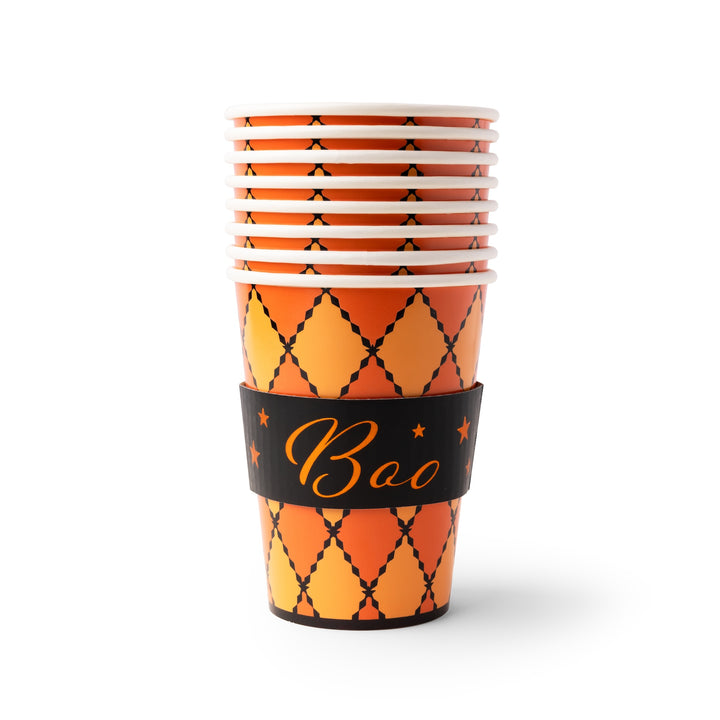 A stack of Halloween party cups with an orange and yellow argyle pattern, featuring a black paper sleeve around the middle with the word 'Boo' in gold script.