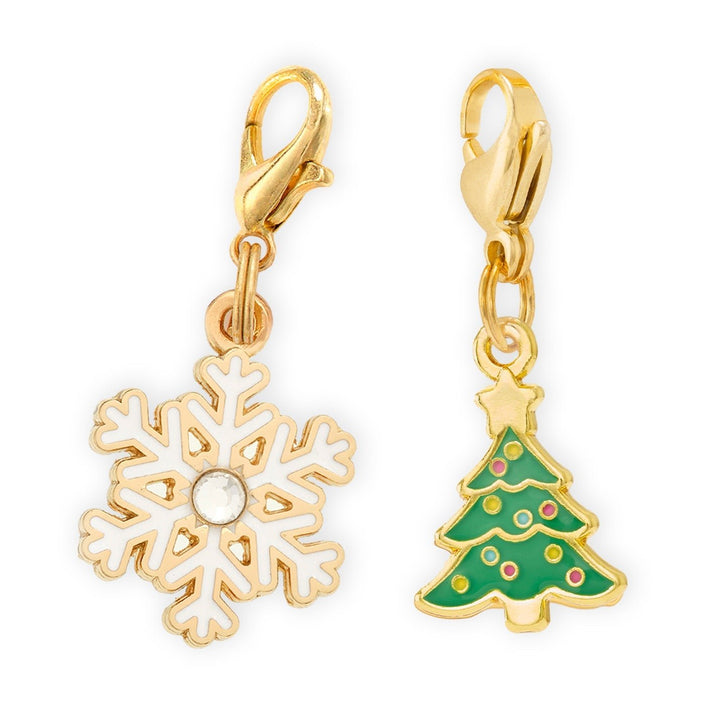 White enamel snowflake charm with a crystal center and a green Christmas tree charm with a gold star, on lobster clasps