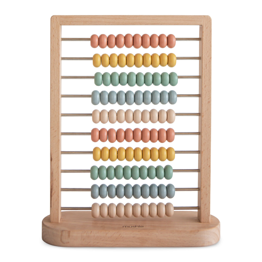 Mushie wooden abacus in muted tones with beads on sturdy rods