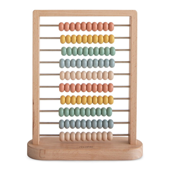 Mushie wooden abacus in muted tones with beads on sturdy rods