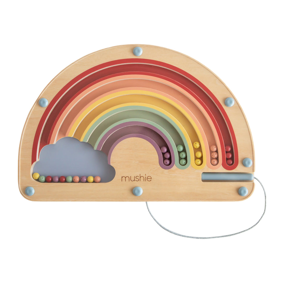 Mushie wooden magnetic rainbow maze with colorful beads and an attached pen