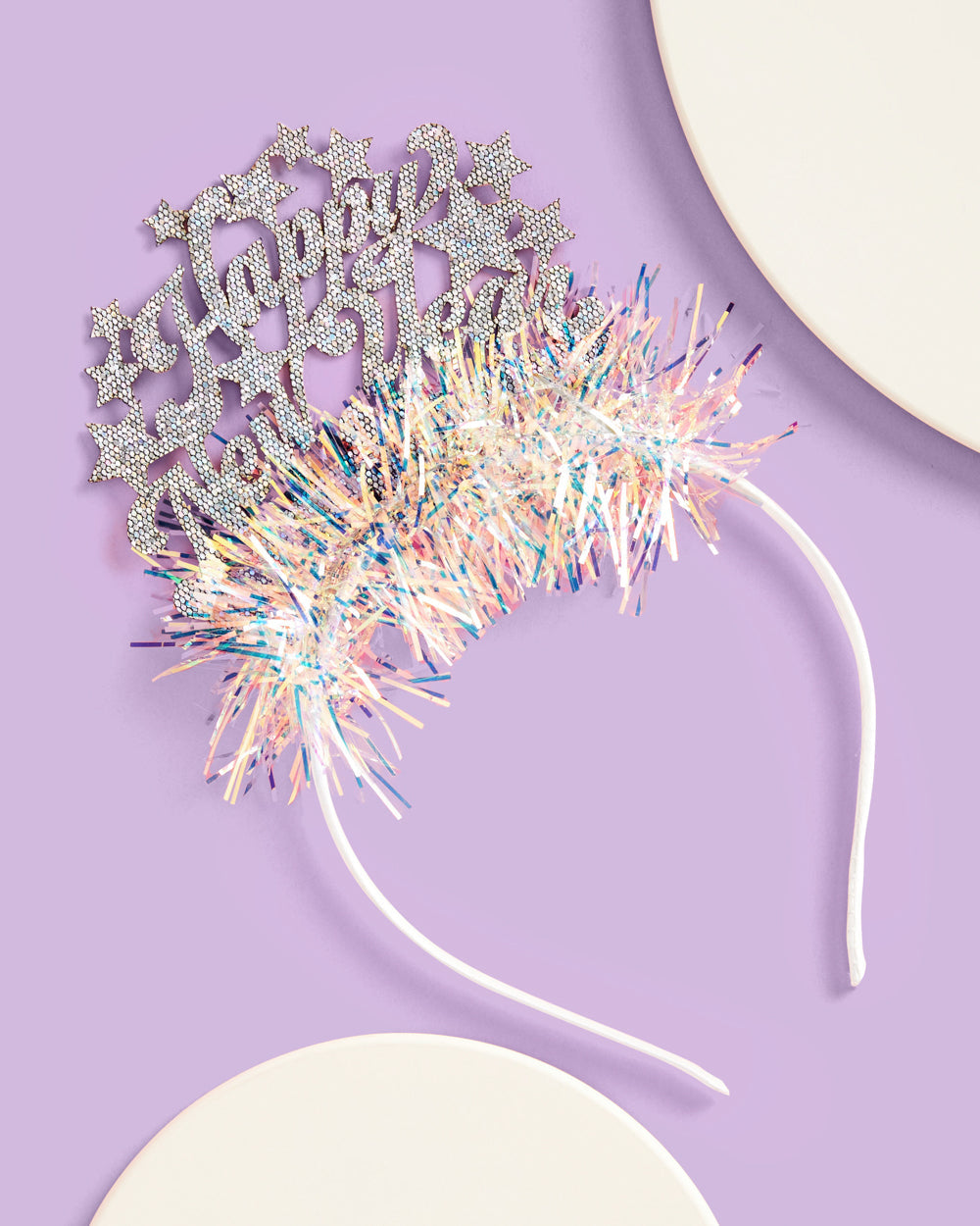 Happy New Year headband with iridescent fringe against a lavender background