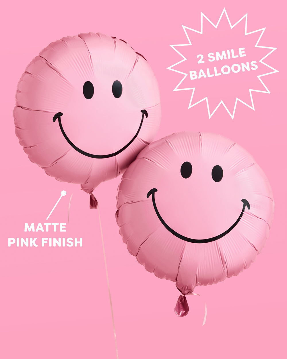 Pink smiley face balloon close up