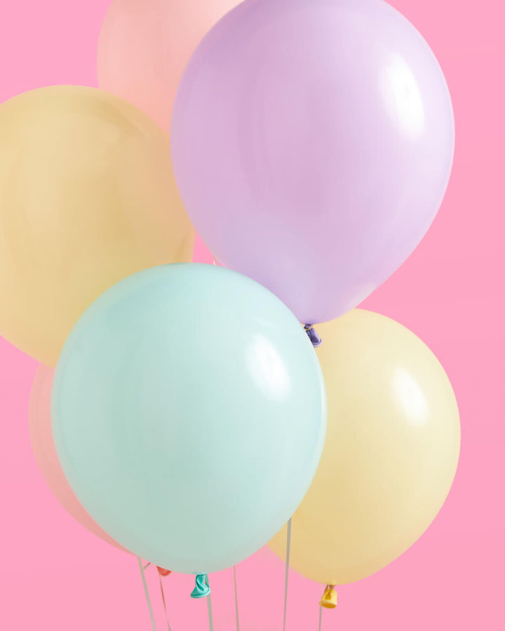 Pastel balloons styled as a party backdrop