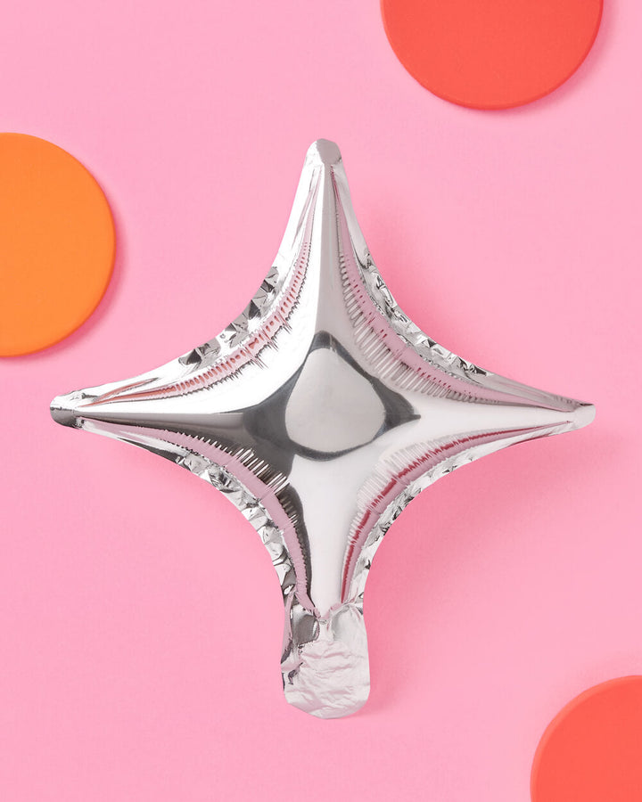 Silver sparkle foil balloons styled with party decor