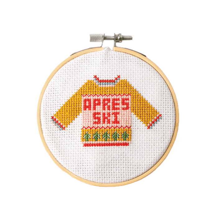 Apres ski Christmas sweater cross stitch hoop with yellow pullover on white fabric