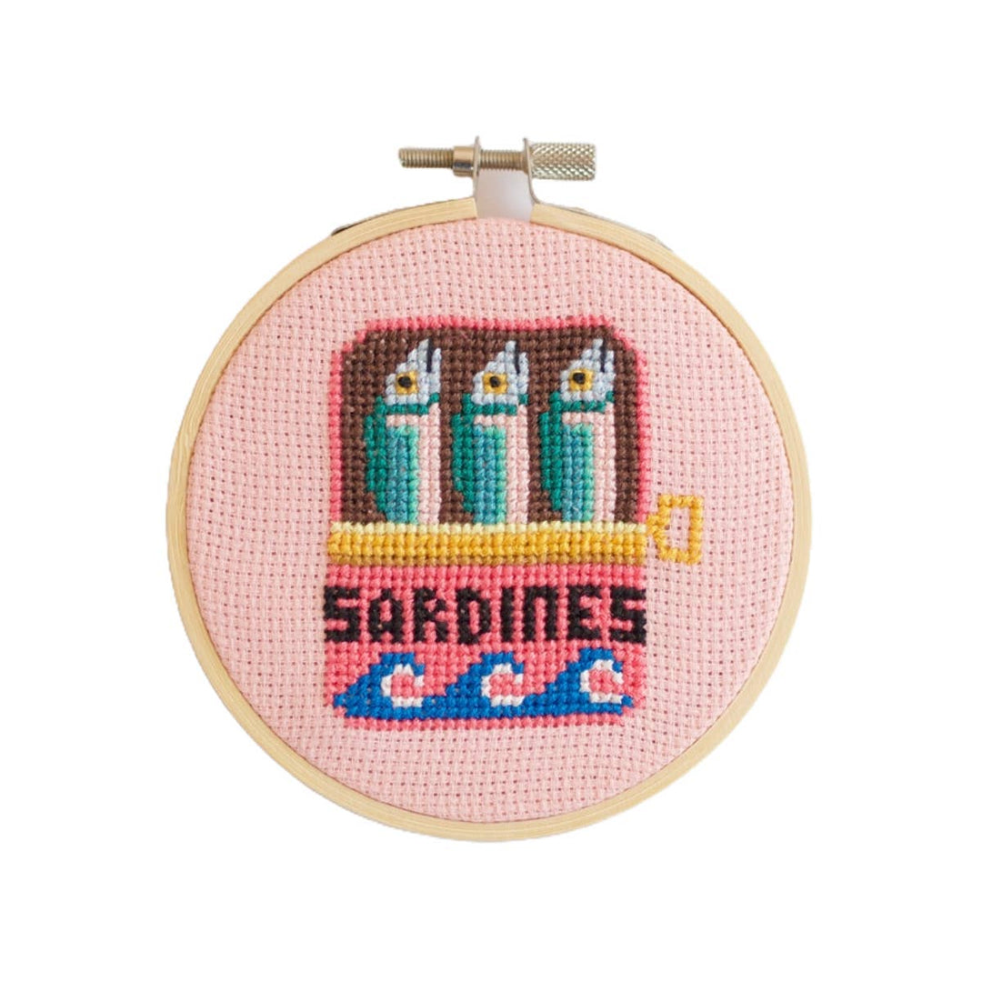 Sardines cross stitch kit finished hoop with sardine tin design on pink aida fabric