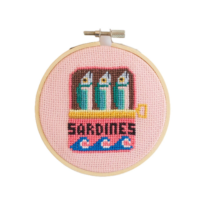 Sardines cross stitch kit finished hoop with sardine tin design on pink aida fabric