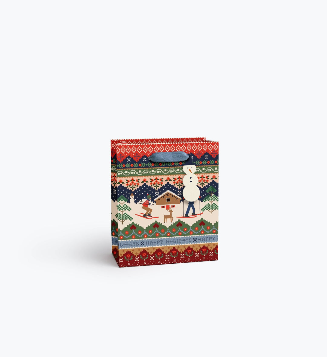 Ski Chalet holiday gift bag with snowman tag and slate blue ribbon handles in fair isle print