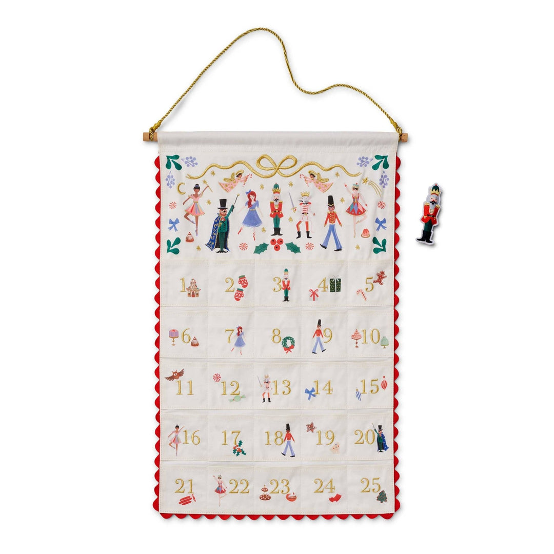 Nutcracker fabric advent calendar with embroidered ballet characters, 25 pockets, red ric rac, and nutcracker figurine