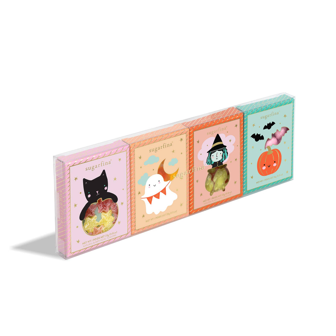 Four Sugafina brand candy boxes with Halloween-themed illustrations, including a black cat in a hat, a white ghost, a witch on a broomstick, and a jack-o'-lantern, arranged diagonally on a white background.