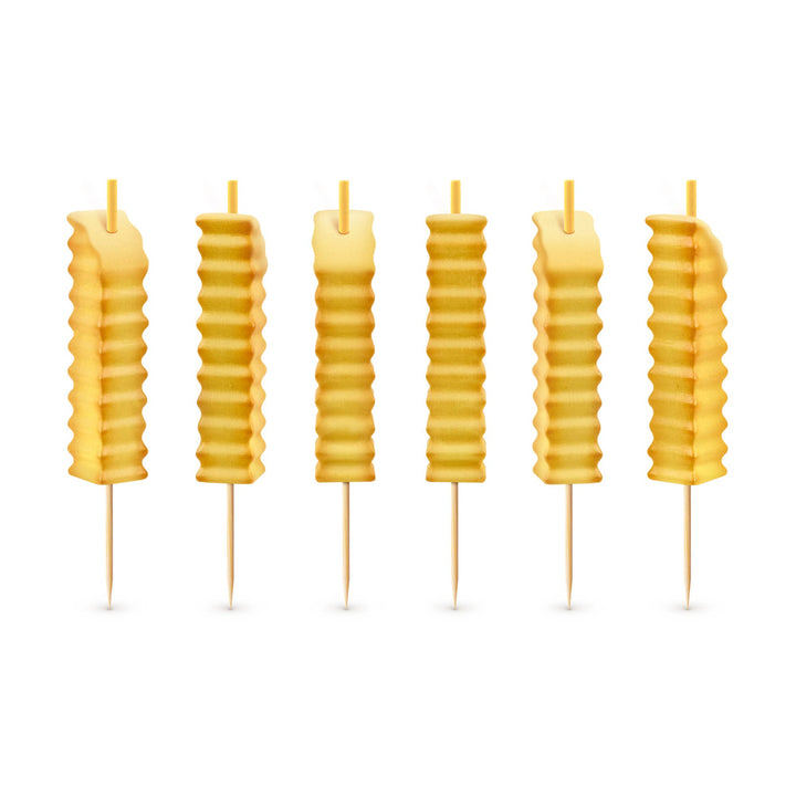 Set of six crinkle-cut french fry birthday candles on white background, showing yellow wax texture and toothpick picks