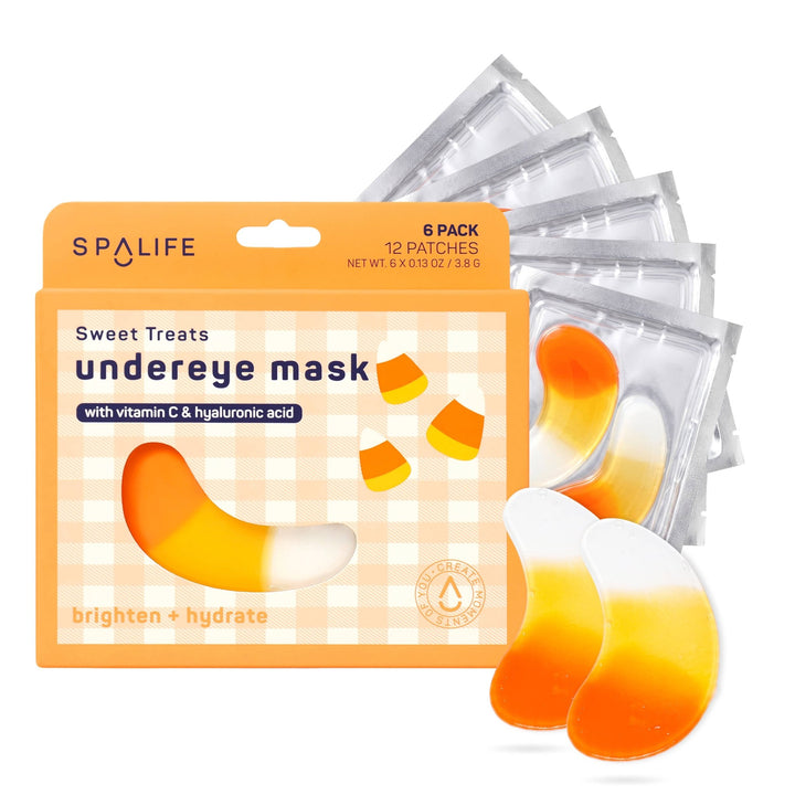 Candy corn under eye patches and foil sachets fanned out behind the orange six pack box for Halloween pampering