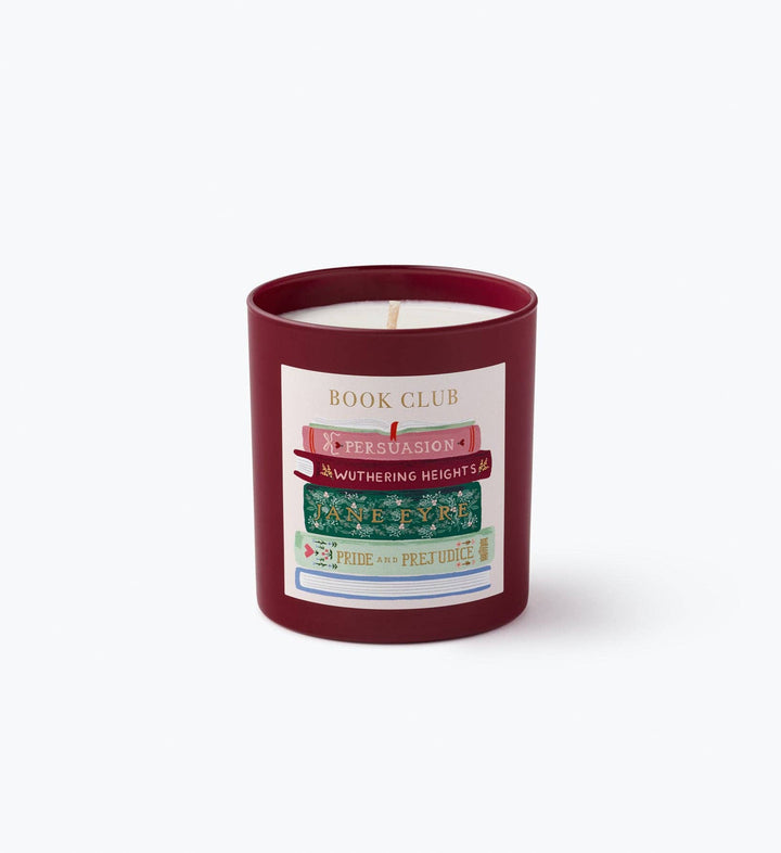 Burgundy Book Club glass candle showing classic novel spines label, a cozy reading nook accent
