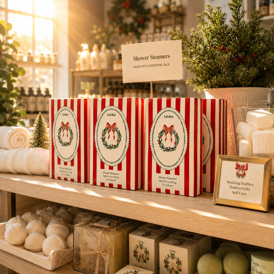 Red striped steamer boxes on a sunlit shelf with a stocking stuffers and hostess gifts sign for Christmas shopping