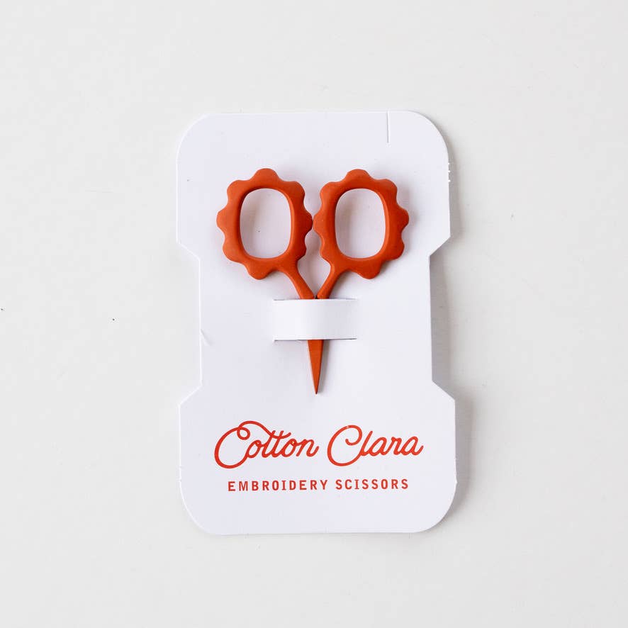 Rust mini flower embroidery scissors on a reusable thread card bobbin