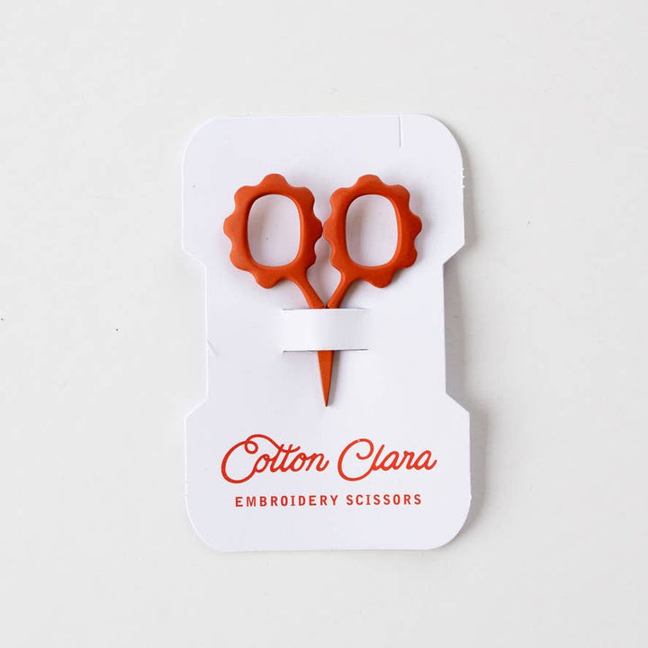 Rust mini flower embroidery scissors on a reusable thread card bobbin