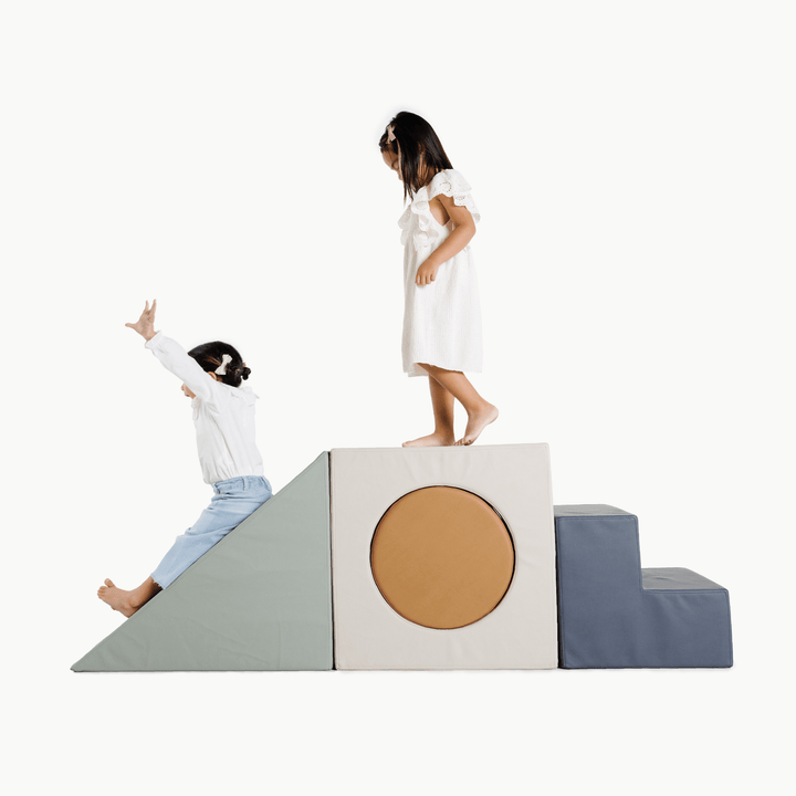 Gathre block playset with foam steps, a cube, and a triangle ramp in cream London print and rust