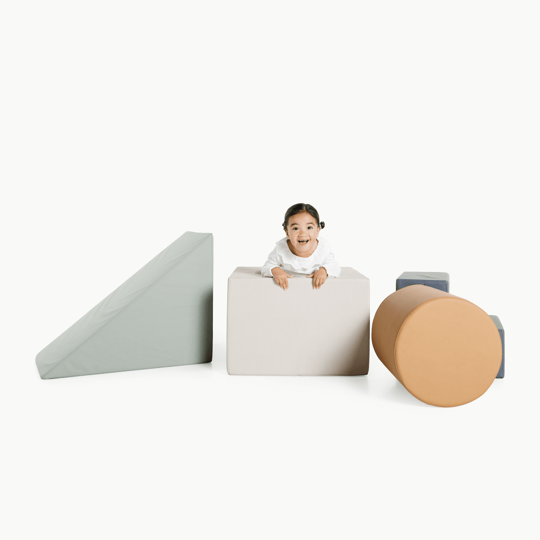 Gathre block playset with foam steps, a cube, and a triangle ramp in cream London print and rust