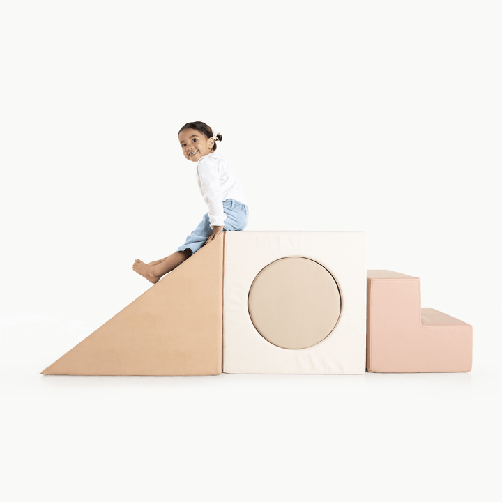 Gathre block playset with foam steps, a cube, and a triangle ramp in cream London print and rust