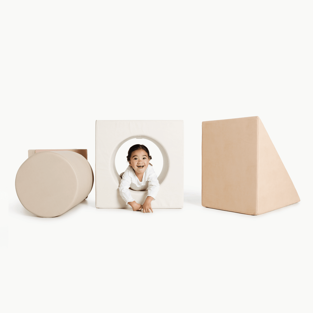 Gathre block playset with foam steps, a cube, and a triangle ramp in cream London print and rust
