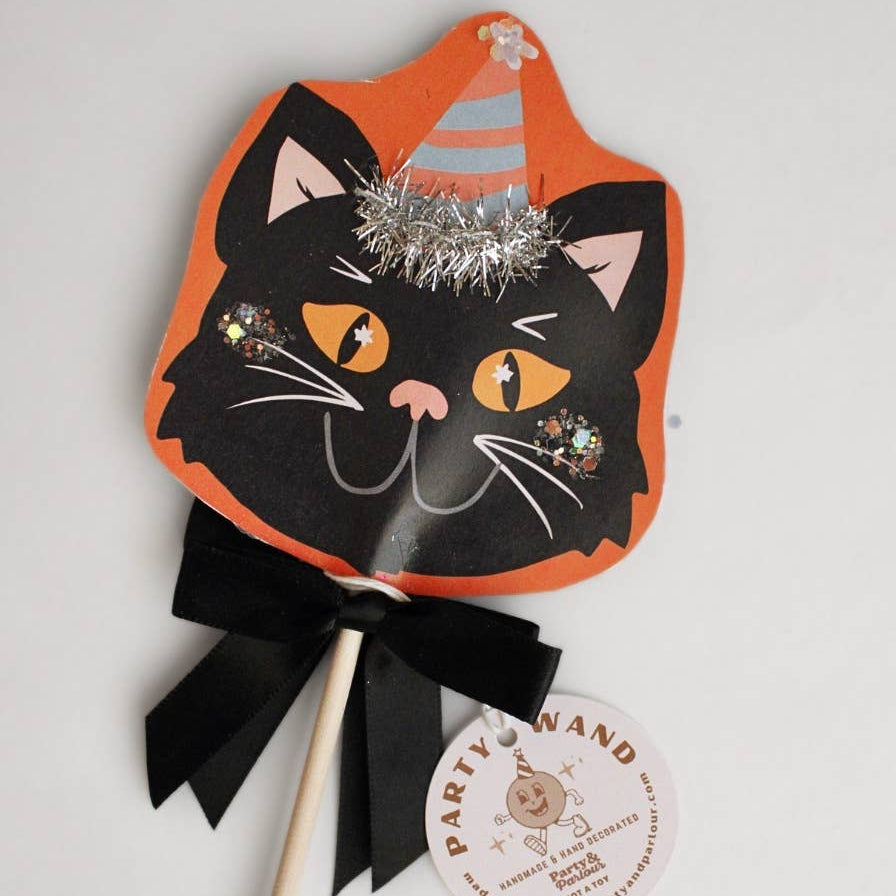Black cat Halloween party wand with glitter, party hat, silver tinsel, and black satin bow for Halloween table decor